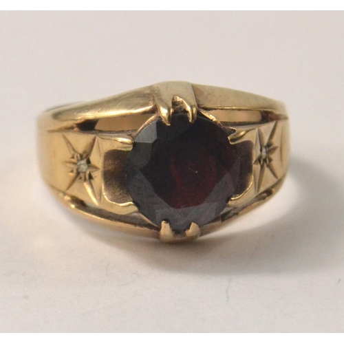 11 - A SUBSTANTIAL 375 stamped yellow gold ring size T with a VERY large ruby inset - a really nice ring!