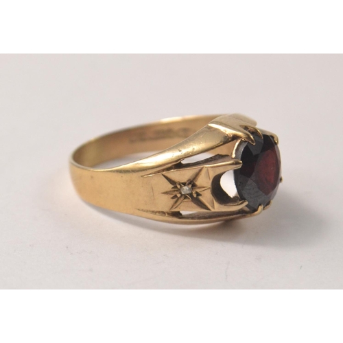 11 - A SUBSTANTIAL 375 stamped yellow gold ring size T with a VERY large ruby inset - a really nice ring!