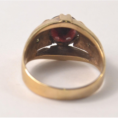 11 - A SUBSTANTIAL 375 stamped yellow gold ring size T with a VERY large ruby inset - a really nice ring!