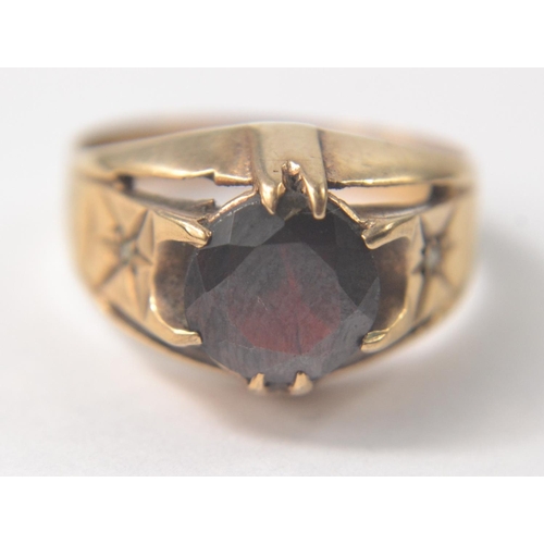 11 - A SUBSTANTIAL 375 stamped yellow gold ring size T with a VERY large ruby inset - a really nice ring!