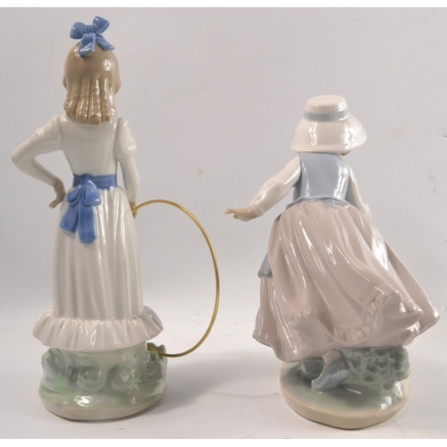 137 - 2 NAO figures to include a little girl with puppy and hoop and little girl in a bonnet with hoop