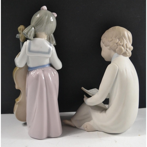 198 - 2 figures young boy in night dress reading (17cm approx) made in Spain and little girl with cello (2... 