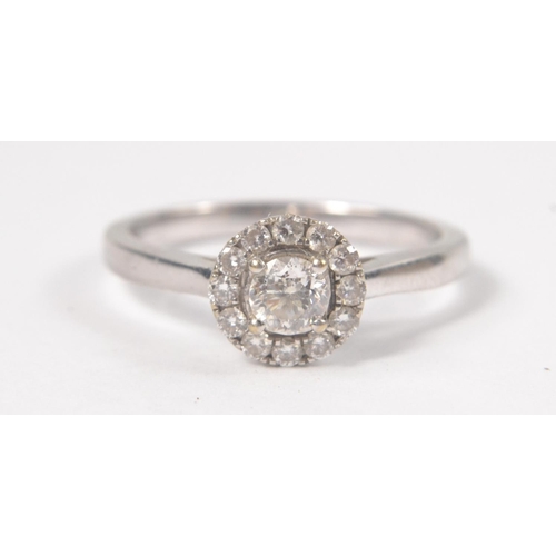 2 - A white gold 750 stamped white gold and diamond (tested) inset (ring states 0.5carat in weight for t... 