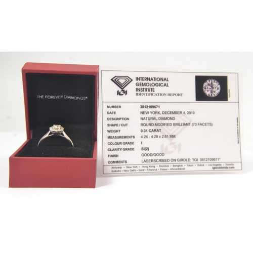 2 - A white gold 750 stamped white gold and diamond (tested) inset (ring states 0.5carat in weight for t... 