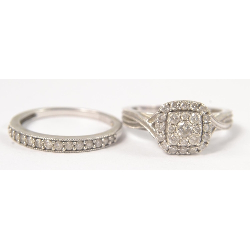 4 - A Bridal set of two rings in 9K stamped white gold with 0.455ct of diamonds inset in the engagement ... 