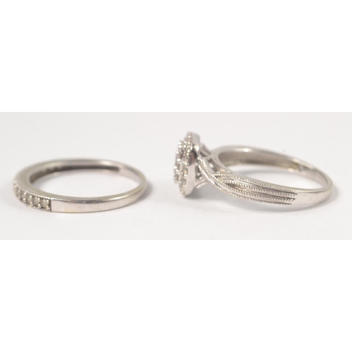 4 - A Bridal set of two rings in 9K stamped white gold with 0.455ct of diamonds inset in the engagement ... 