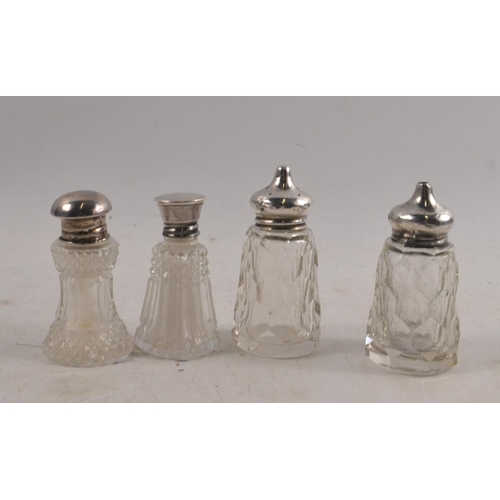 41 - A collection of four salt and pepper sets Silver Hallmarked