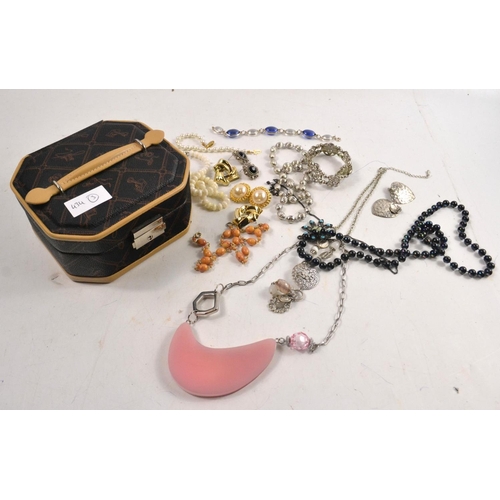 48 - A medium sized nice quality designer style jewellery box with some nice quality costume jewellery.