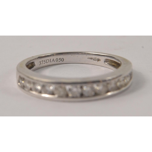 5 - 375 stamped white gold with 0.5cts diamonds tested half eternity 2.55g gross ring size R