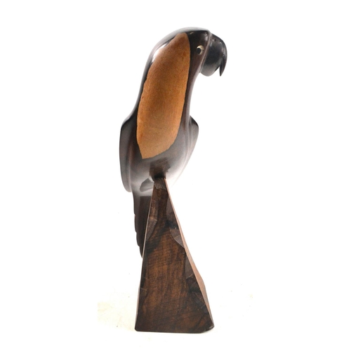 85 - A hard wood perched parrot 31cm height