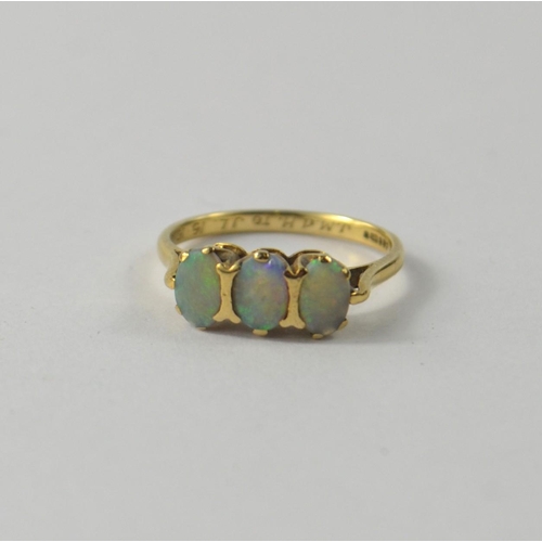 1 - OPAL dress ring, three cabouchon cut stones measuring 6mm x 4mm gross weight 1.65g [size M ]