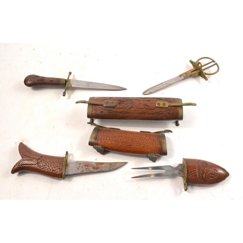 179 - Two unusual Indian style wooden  holders. One with knife and scissors, other fish shaped with knife ... 