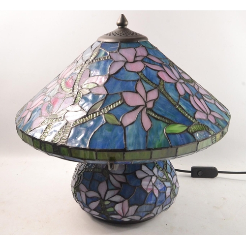 189 - UNUSUAL TIFFANY inspired table lamp with blue background and lilac floral decoration(Diameter taken ... 