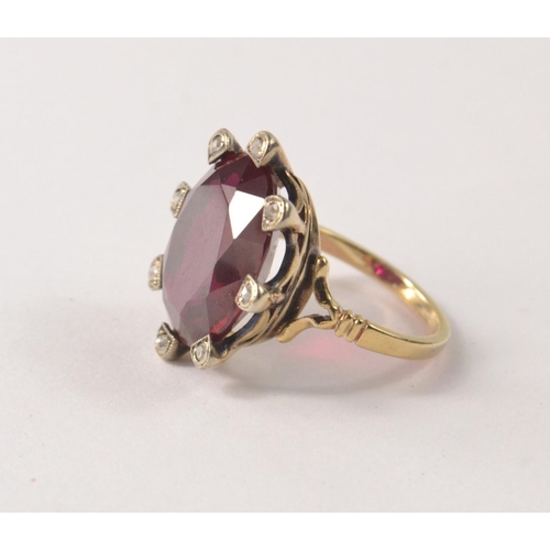 36 - Unhallmarked 'yellow metal' valued as 14ct gold flame fusion ruby with 8 small rose cut diamonds rin... 