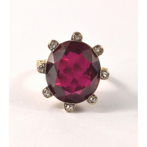 36 - Unhallmarked 'yellow metal' valued as 14ct gold flame fusion ruby with 8 small rose cut diamonds rin... 