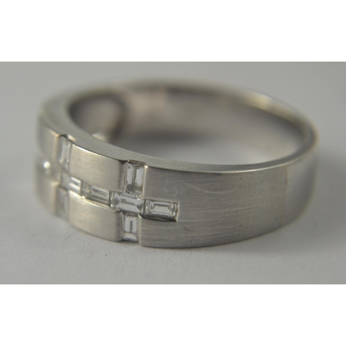 37 - A nice quality BLING 750 stamped white gold band with a total of 0.78 carats in baguette cut diamond... 