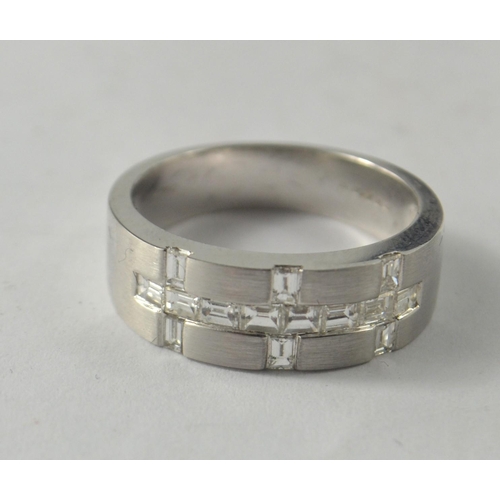 41 - A nice quality BLING 750 stamped white gold band with a total of 0.78 carats in baguette cut diamond... 