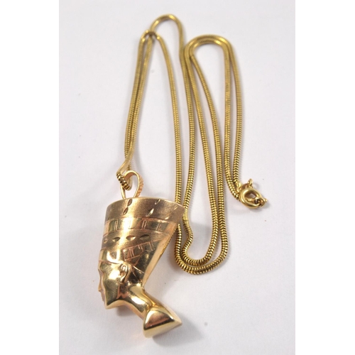 59C - 750 stamped yellow gold snake design necklace [L: 72cm approx] and a yellow metal pharoh head pendan... 