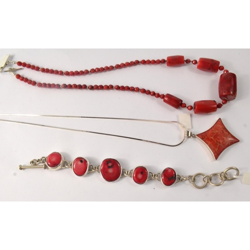 83 - A nice quality red coral romboidal pendant with chain, with also a red coral necklace and lastly a l... 