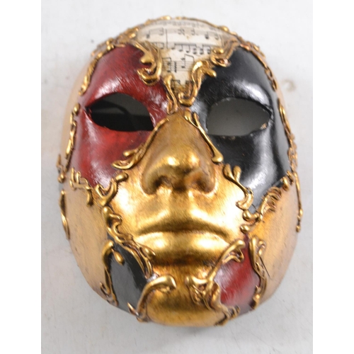 63 - A REAL VENETIAN MASK!! Handmade and hand painted in black gold red colours with a musical sheet styl... 