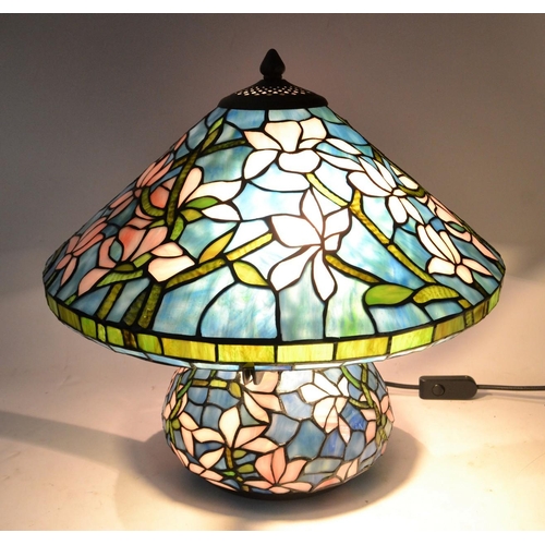 91 - UNUSUAL TIFFANY inspired table lamp with blue background and lilac floral decoration(Diameter taken ... 