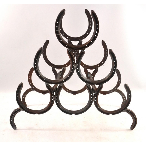 97 - A RUSTIC LOCALLY HANDMADE Blacksmiths' horseshoe wine rack  x 6 bottle