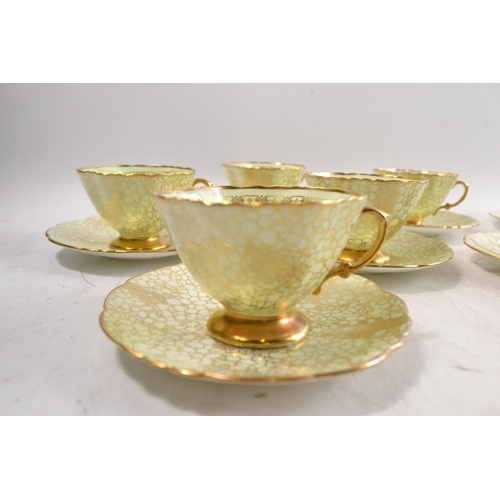 17 - An 8 cup 7 saucer HAMMERSLEY LONGTON tea set with pastel green background and gilt pattern overlay N... 