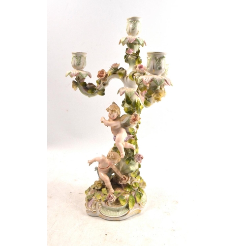 24K - C late 19th century East German VON SCHIERHOLZ GERMAN PORCELAIN CHERUB FIGURAL CANDELABRA with flora... 