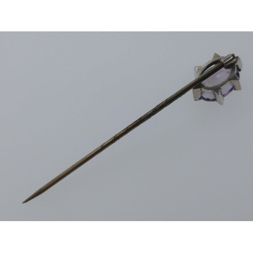 21 - Yellow metal stick pin set with pale purple stone set in star design. Comes in presentation case#45... 