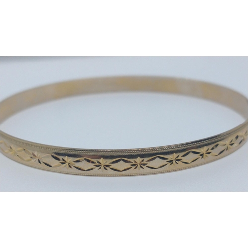 7A - A nice 375 stamped yellow gold bangle weight 10.05g approx and 7cm in diameter#15