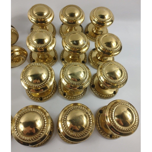 224 - Nine pairs of modern brass door knobs plus 10 spindles - 6 x 11cm approx, 2 x 12cm approx. and 2 x 1... 