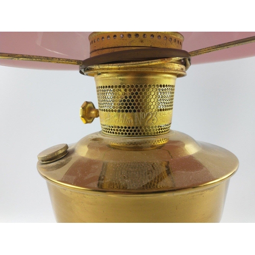 226 - Oil lamp with vibrant red shade.  Stands 60cm tall.#283