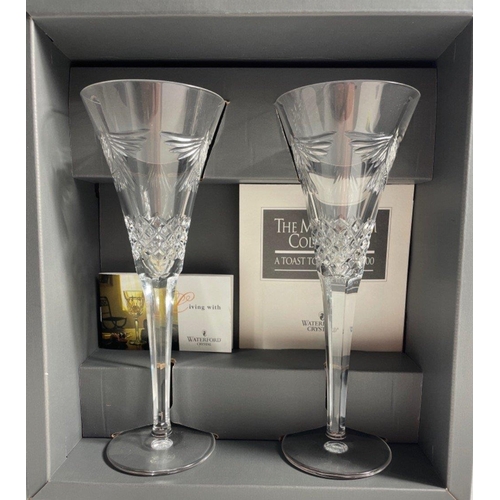 213 - WATERFORD CRYSTAL THE MILLENNIUM COLLECTION TWO LARGE CHAMPAGNE FLUTES in original gifting box. Engr... 