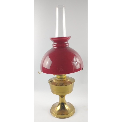 226 - Oil lamp with vibrant red shade.  Stands 60cm tall.#283