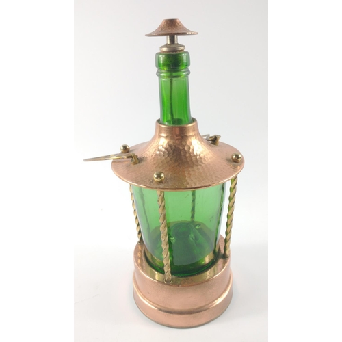 229 - A VINTAGE copper framed green-bottle lantern style lamp with carry handle and wind up MUSICAL base#2... 