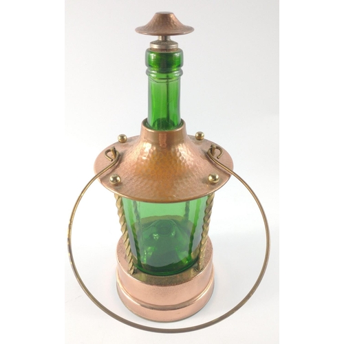 229 - A VINTAGE copper framed green-bottle lantern style lamp with carry handle and wind up MUSICAL base#2... 