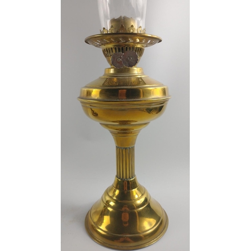 230 - Two brass-effect oil lamps, one with shade both with chimneys approx. 50cm each.#288