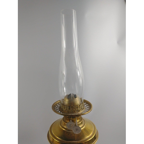 230 - Two brass-effect oil lamps, one with shade both with chimneys approx. 50cm each.#288
