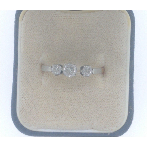 14 - An 18ct stamped yellow gold engagement ring, set in platinum with three diamonds inset, the middle d... 