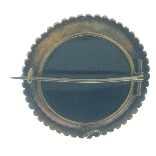 54 - VINTAGE Circular Yellow metal brooch with floral centre set with amethysts and a small seed pearl in... 