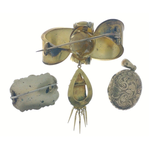 56 - 2 Vintage yellow metal booches and a yellow metal oval engraved locket#57