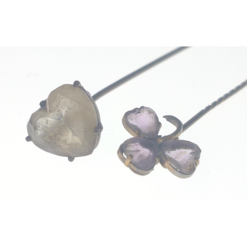 57 - A VICTORIAN large 'yellow metal' hat pin with a heart shaped white stone inset 17.5cm long approx we... 