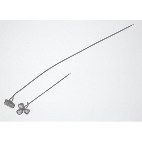 57 - A VICTORIAN large 'yellow metal' hat pin with a heart shaped white stone inset 17.5cm long approx we... 