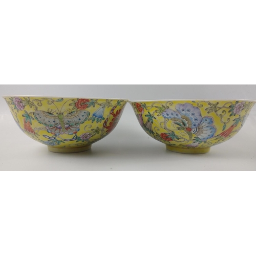 132 - A PAIR of 19th century porcelain hand painted ORIENTAL BOWLS with yellow base and floral decoration ... 