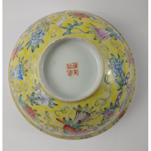 132 - A PAIR of 19th century porcelain hand painted ORIENTAL BOWLS with yellow base and floral decoration ... 