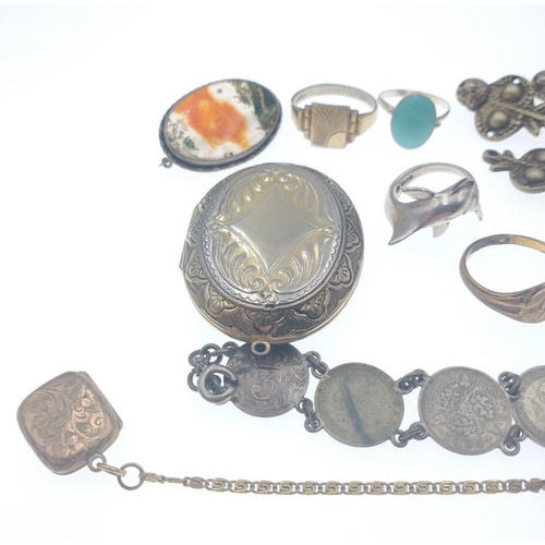 29 - Mixed lot to include 3 rings, oval metal locket, brooch and a silver three pence bracelet [15.3grm] ... 