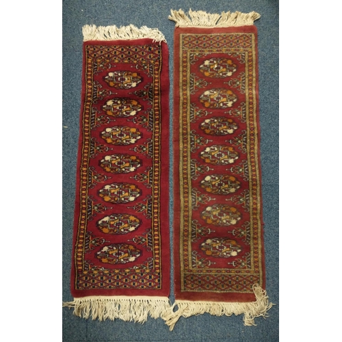 402 - TWO Handmade MATCHING RED BASED RUGS one of which is more worn#447