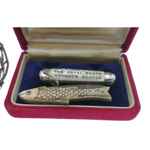 41 - Two PENKNIVES one inscribed 'The Royal Scots Dragoon Guards', the other in the shape of a fish inscr... 