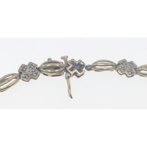 8 - 9ct Yellow gold and Diamond link bracelet, The diamonds are set in 14 small crosses with chain links... 