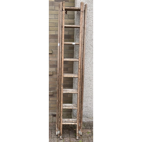 107 - A TRIPLE SET OF VINTAGE LADDERS X 8 rungs on each extension#109